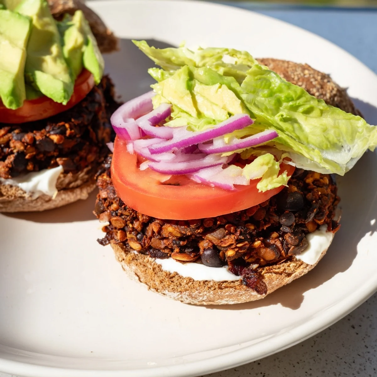Freshly made Zesty Weeknight Black Bean Burgers with all the fixings, a delicious vegetarian meal.