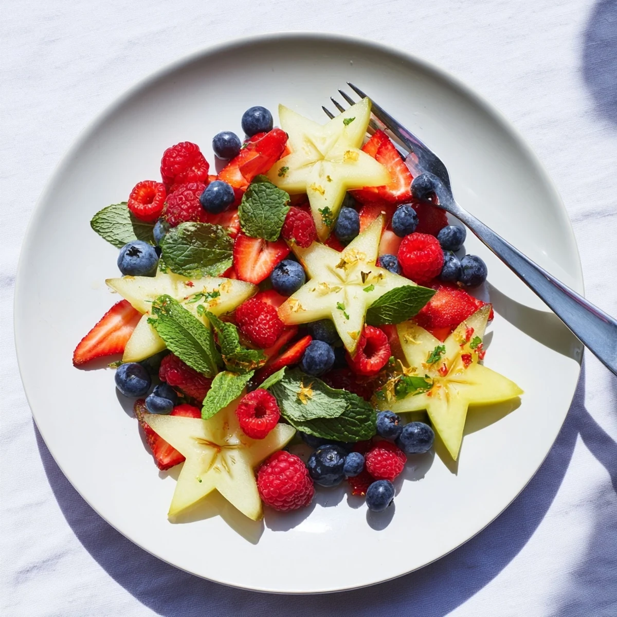 A beautiful close-up of the starfruit and berry platter, showcasing ripe berries and star-shaped fruit.