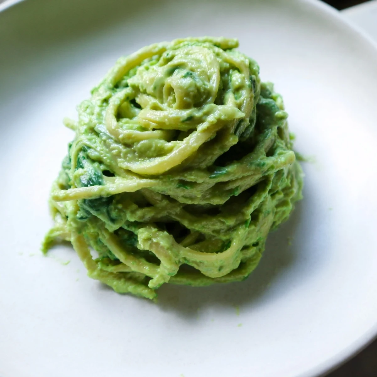 Creamy Green Goddess Pasta Sauce featuring spinach and basil, served over steaming hot pasta tonight.