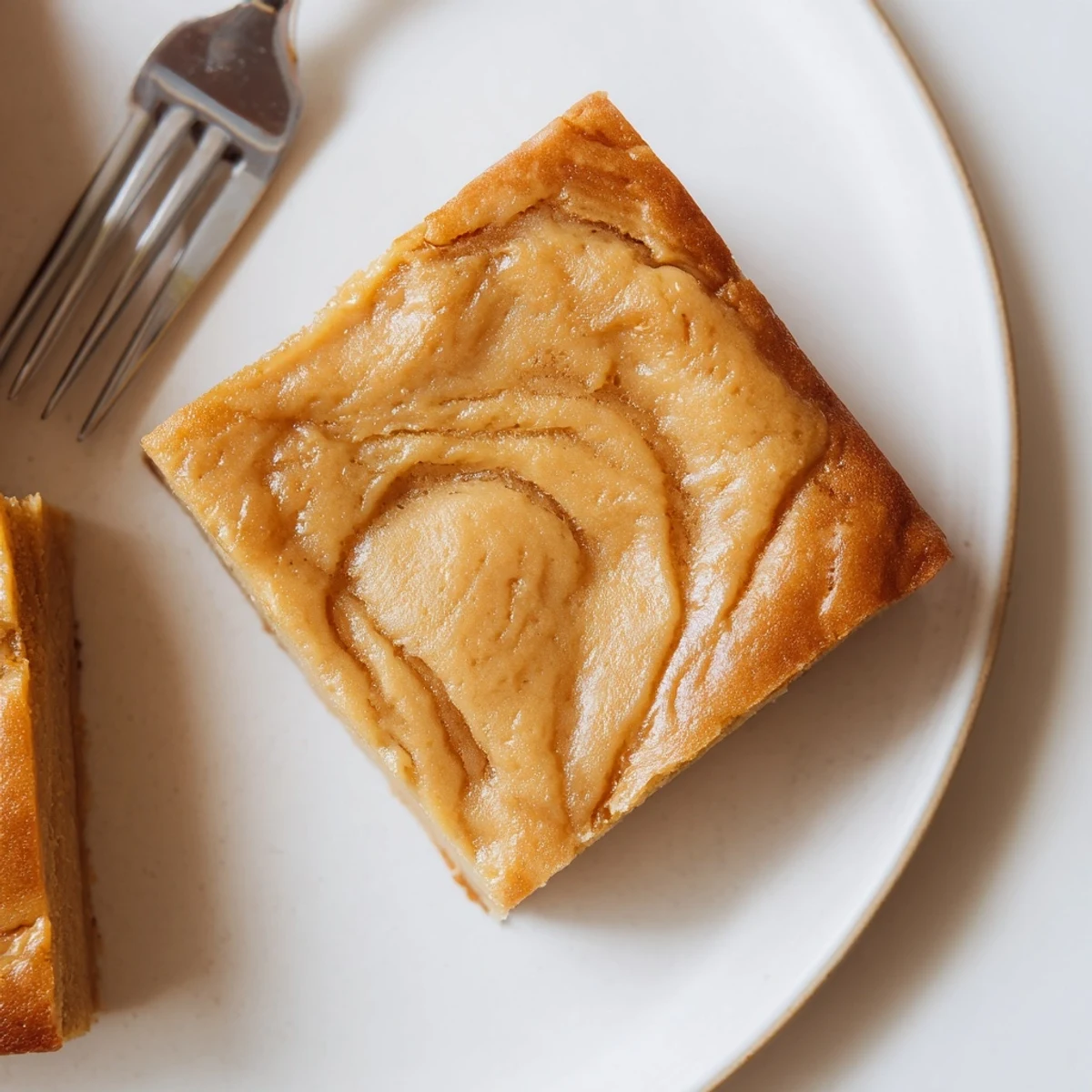 Golden-brown peanut butter mochi cake, a soft, chewy dessert perfect for sharing with family.