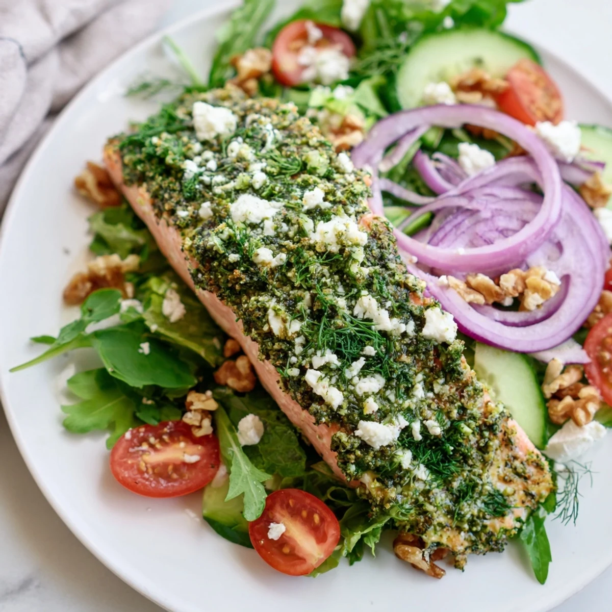 Golden, flaky Herb-Crusted Salmon Salad, a delicious main dish over vibrant salad greens.