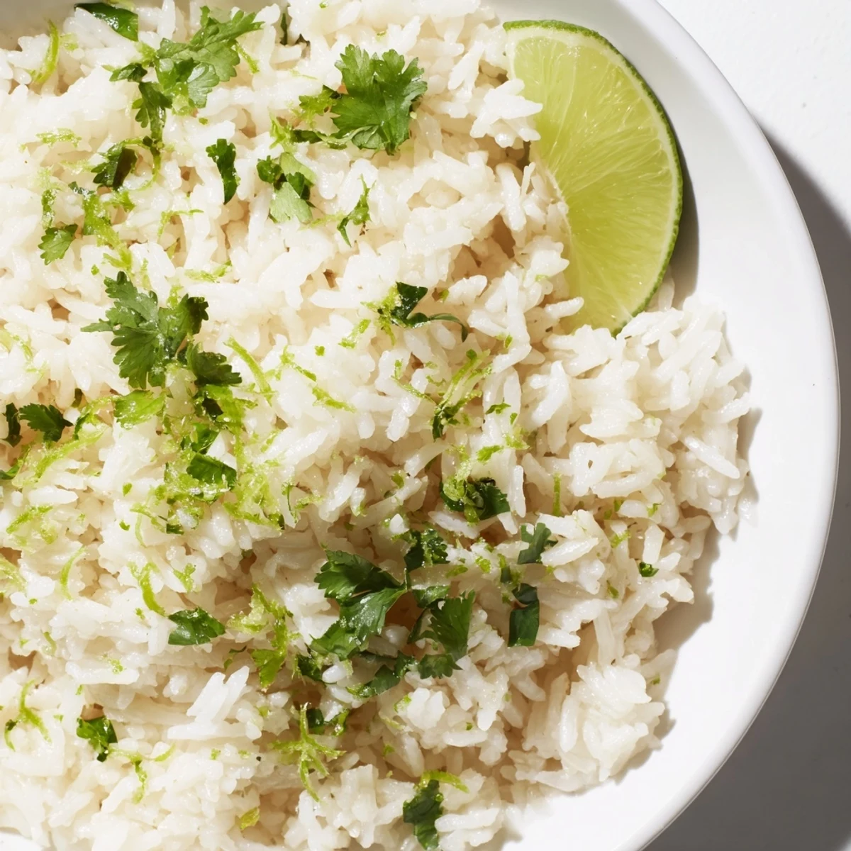 A close-up of steaming Cilantro Lime Rice, ready to serve with grilled chicken or fish for dinner.