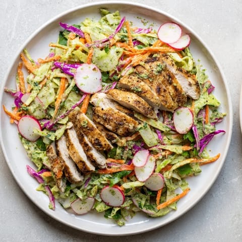 Vibrant Green Goddess Cabbage Slaw with Grilled Chicken, a fresh and delicious, healthy meal.