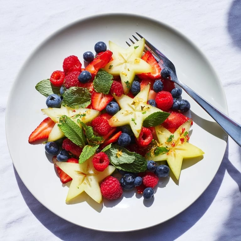 A beautiful close-up of the starfruit and berry platter, showcasing ripe berries and star-shaped fruit.