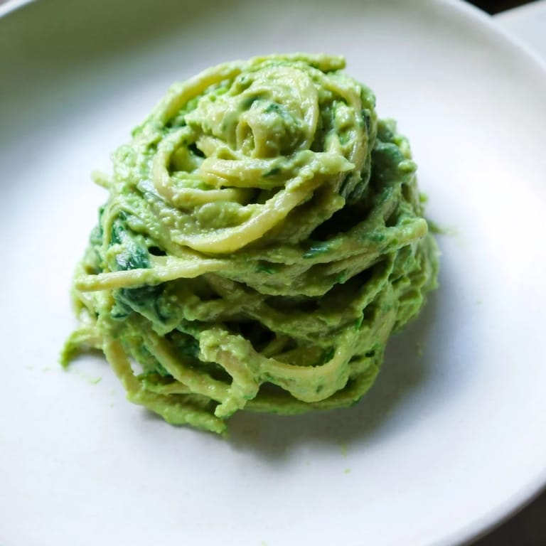 Creamy Green Goddess Pasta Sauce featuring spinach and basil, served over steaming hot pasta tonight.
