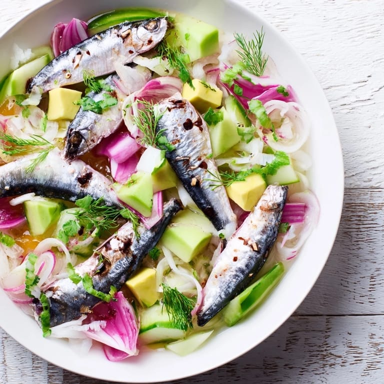 Layered Cucumber and Tinned Fish Date Night Salad, showing fresh ingredients and a tasty vinaigrette, a delicious meal.