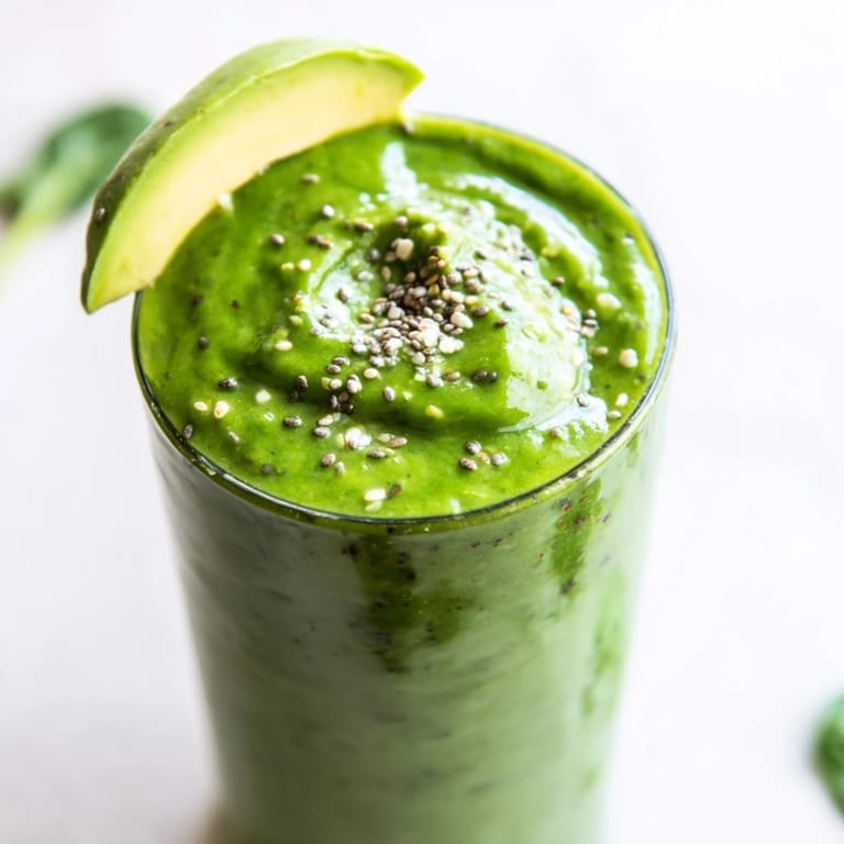 Enjoy the refreshing taste of this Spinach Avocado Smoothie, blended to a velvety, smooth texture.