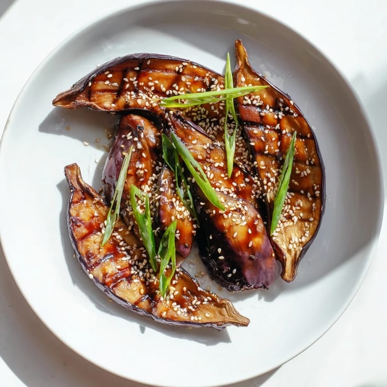Tender roasted miso glazed eggplant served warm over steamed rice, a perfect vegan side dish for Japanese meals.  